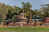 Thailand, Old Sukhothai - Wat Mahathat, the remains of a bot with a large seated Buddha. 